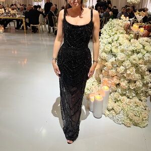 Black gown by Albina Dyla. US 4